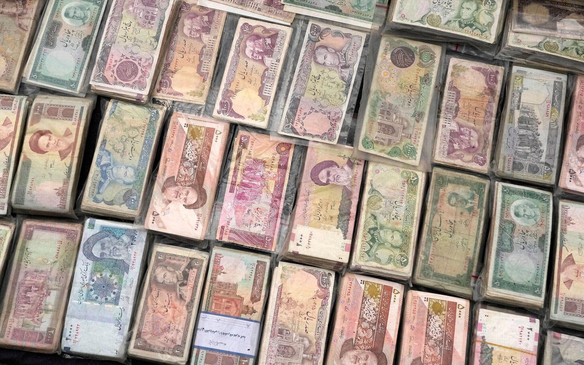 Current and pre-revolution Iranian banknotes displayed at a venue for foreign currency exchange, in Tehran on February 5, 2025. Photo: AP