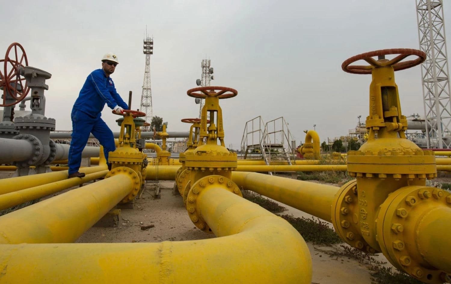 An employee turns a valve at the Nahr Bin Omar natural gas field, north of the Iraqi city of Basra on April 20, 2020. File photo: AFP