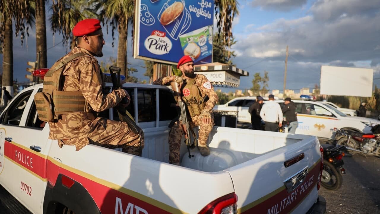 Police patrol an area after clashes between protesters from the Alawite religious minority and counterprotesters erupted two days after an attack on an Alawite mosque in Latakia on December 26, 2025 . Photo: AP