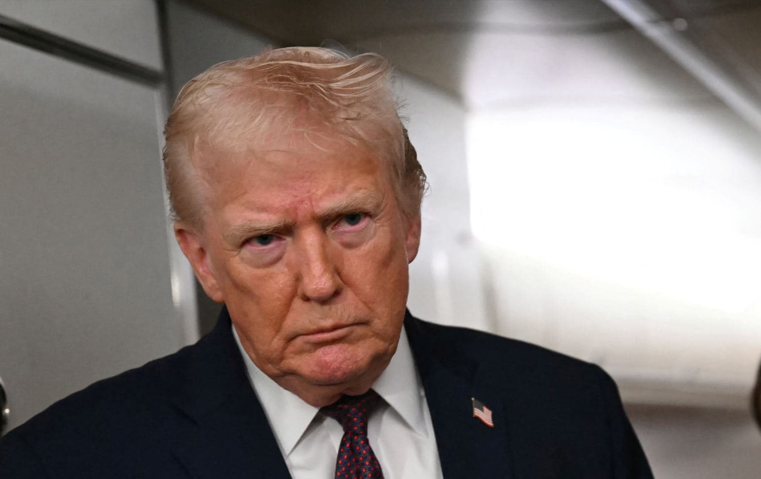 US President Donald Trump speaking to the press aboard Air Force One on January 11, 2026. Photo: Andrew Caballero-Reynolds / AFP