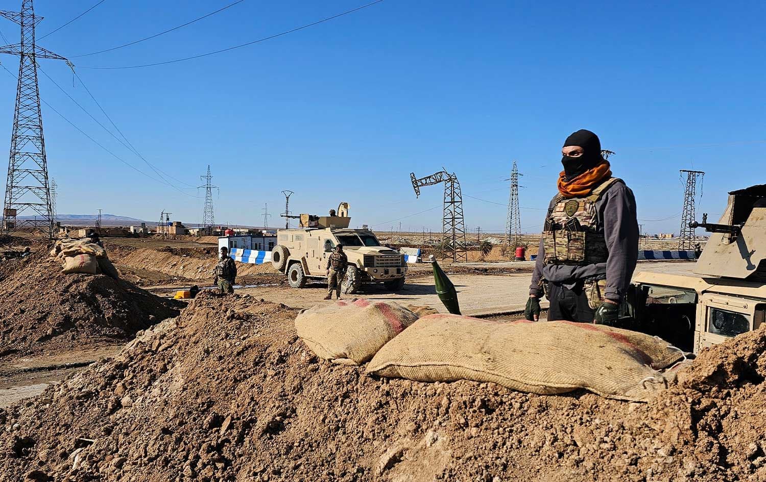 Kurdish fighters stand watch as they prepare to defend the city of Hasake, in northeastern Syria, on January 20, 2026. Photo: AFP