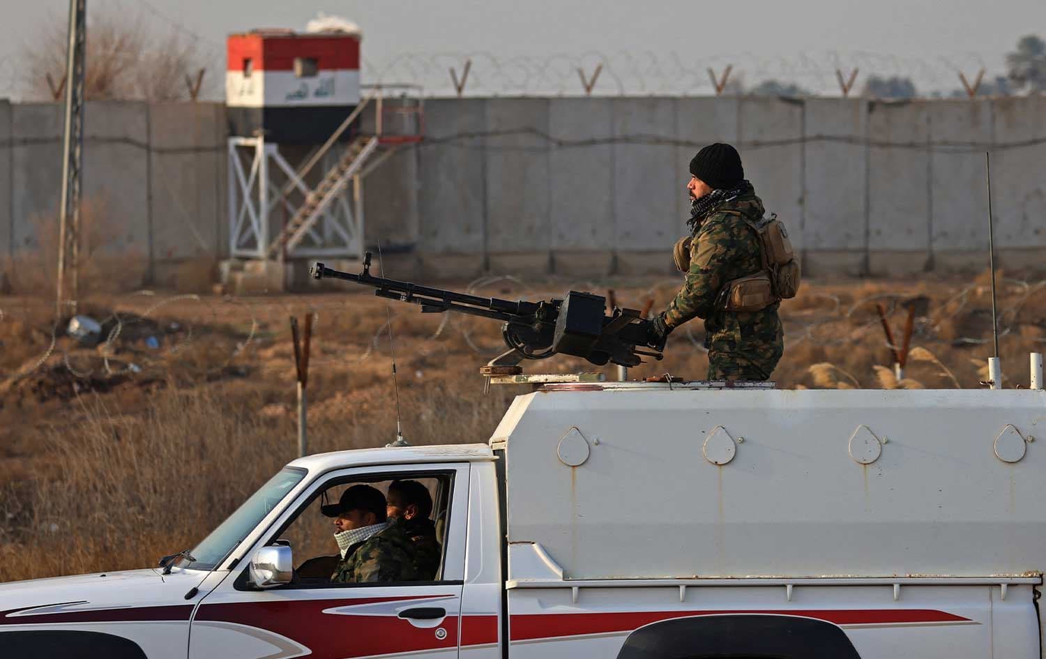 Members of Iraq's Popular Mobilization Forces (PMF) patrol along a concrete wall at the Iraqi-Syrian border in Al-Qaim, west of Iraq on January 23, 2026. File photo: AFP