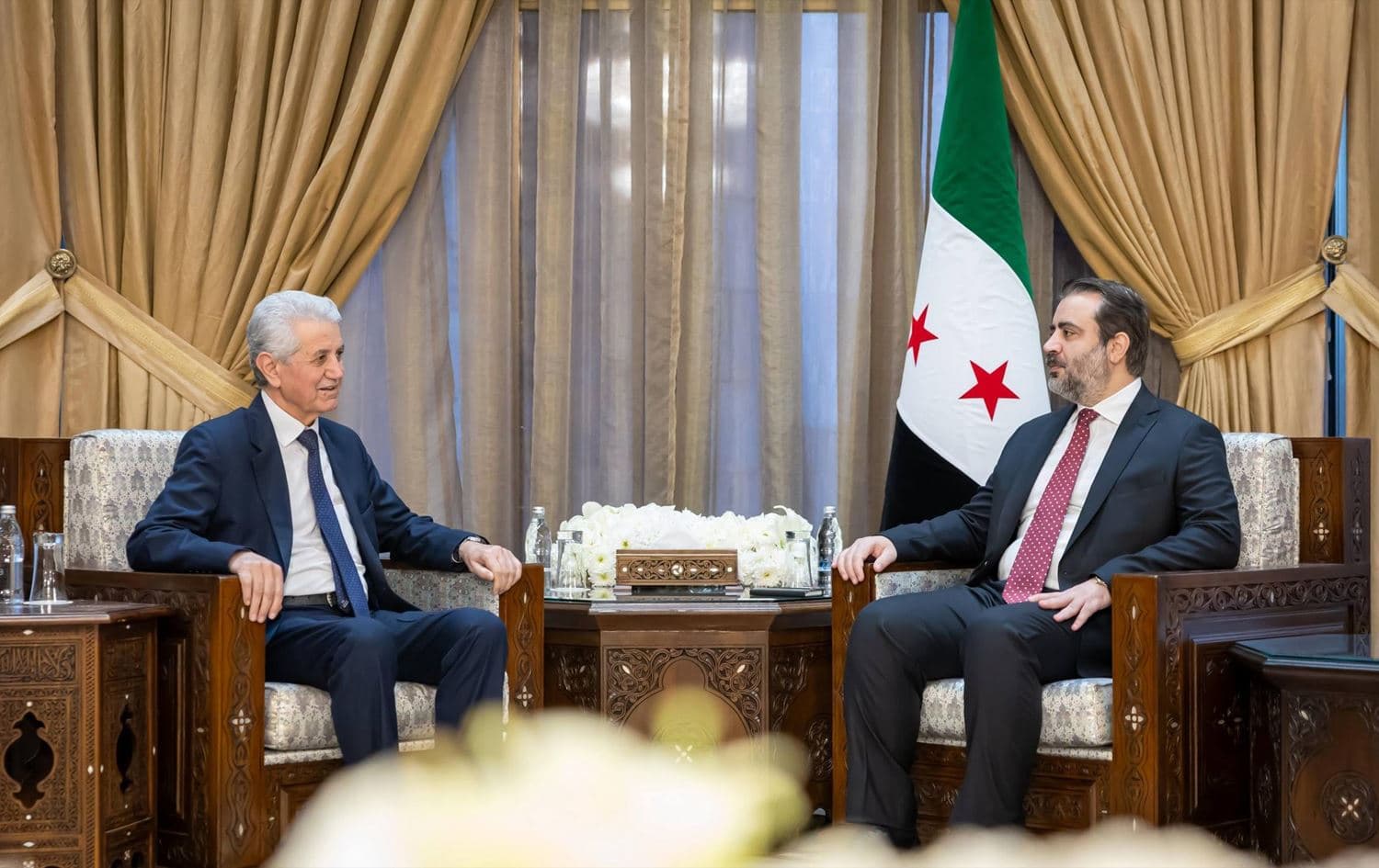 Syria’s interim Foreign Minister Asaad al-Shaibani (right) and Mohammed Ismail, head of ENKS, in a meeting on February 2, 2025. Photo: Syrian Foreign Ministry / Facebook