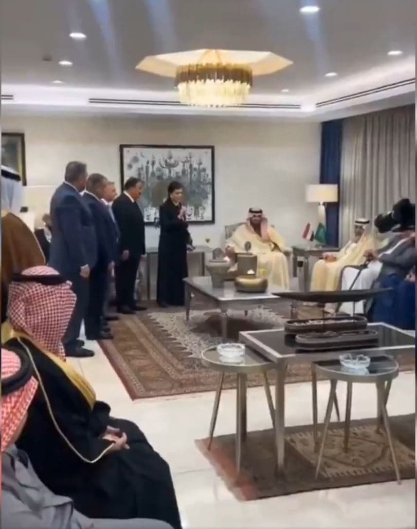 Image taken from footage purports to show staff at the Iraqi embassy in Riyadh standing while speaking to a Saudi delegation seated nearby.