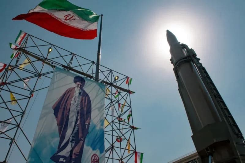 A banner depicting Iran’s Supreme Leader Ayatollah Ali Khamenei is placed next to a ballistic missile in Baharestan Square in Tehran on Sept. 26, 2024. Photo: AFP