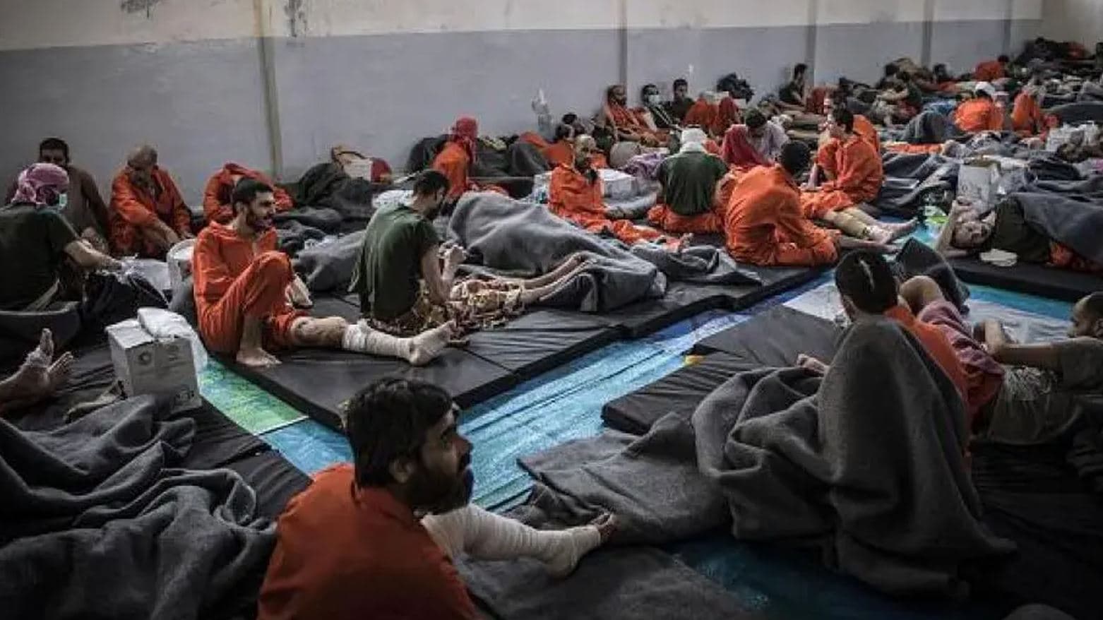 Men, suspected of being affiliated with the Islamic State (ISIS) in a prison cell in the northeastern Syrian city of Hasaka on October 26, 2019. AFP file photo