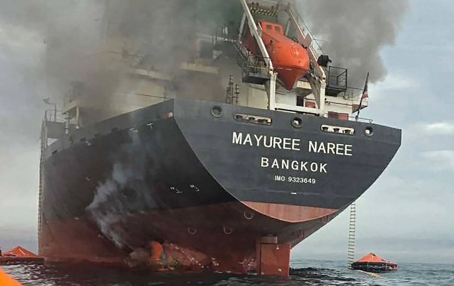 A handout photo taken and released by the Royal Thai Navy shows smoke rising from the Thai bulk carrier “Mayuree Naree” near the Strait of Hormuz after an attack on March 11, 2026. Photo: Handout / Royal Thai Navy / AFP