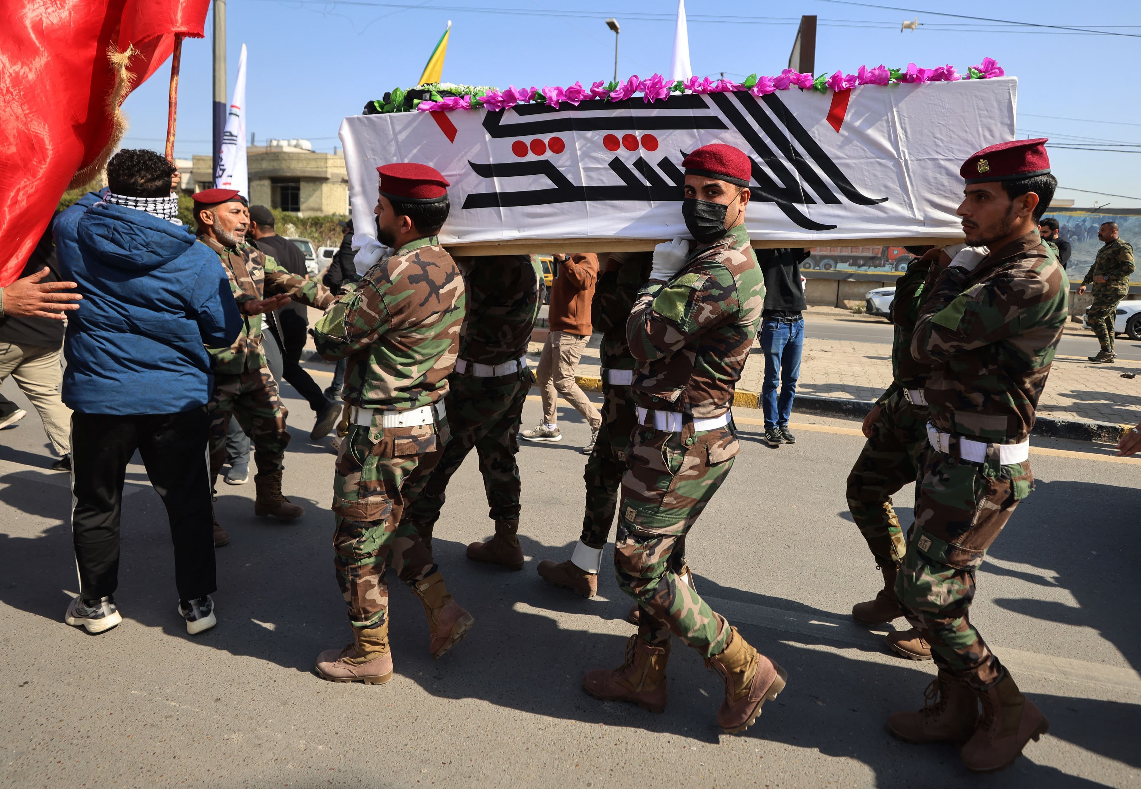 PMF members carry the coffin of a comrade who was reportedly killed in an airstrike in al-Qaim the previous evening, during his funeral in Baghdad on March 11, 2026. File photo: AFP