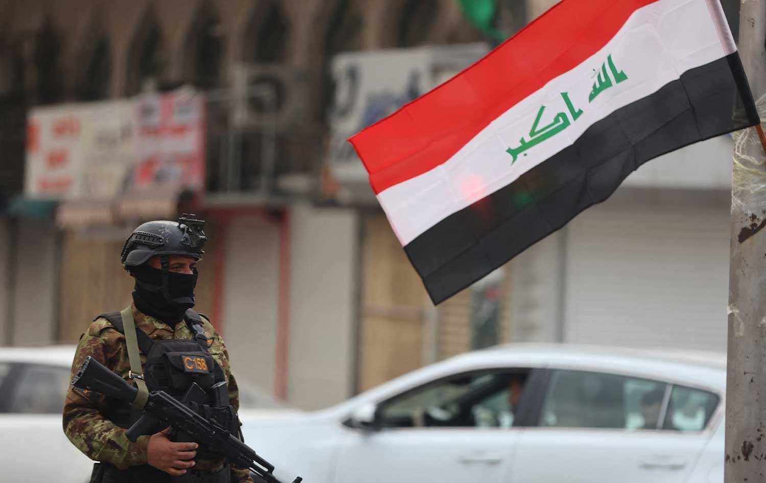 A member of Iraq's Popular Mobilization Forces (PMF) stands guard during a pro-Iran rally in Tahrir Square in Baghdad on April 2, 2026. Photo: AFP