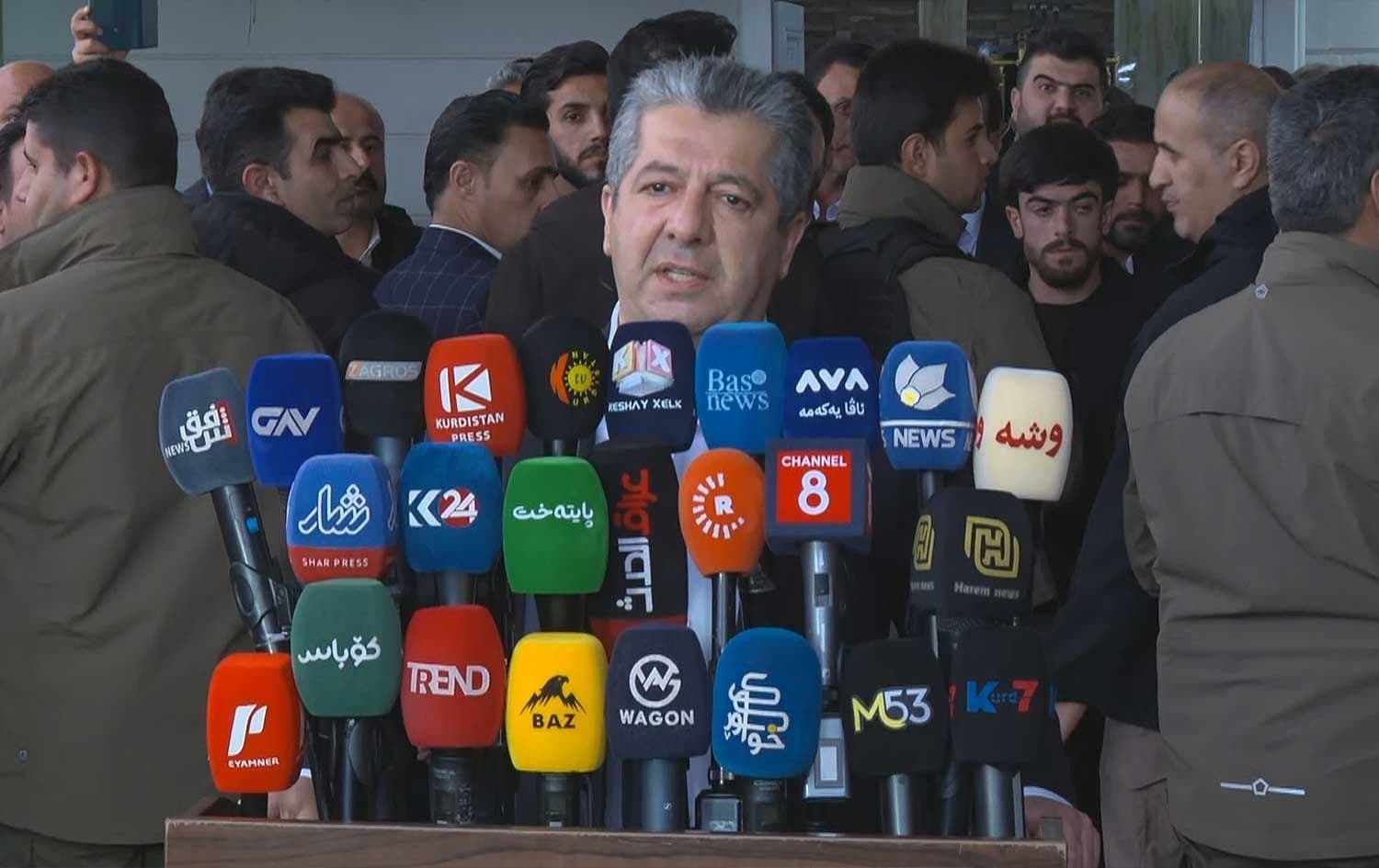 Kurdistan Region Prime Minister Masrour Barzani speaks to reporters on the sidelines of the funeral for a married couple who were tragically killed in a drone attack in northwest Erbil on April 7, 2026. Photo: Screengrab/Rudaw