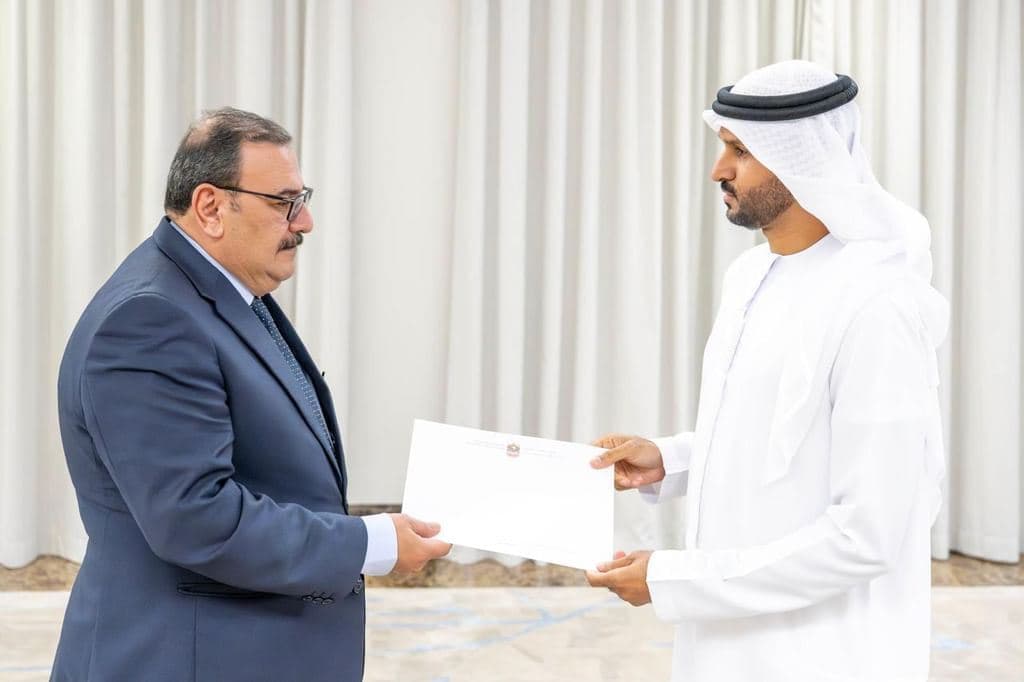 Ahmed Juma al-Marashda, director of the Arab Affairs Department at the Emirati foreign ministry, hands note to Omar al-Obaidi (left), chargé d'affaires at the Iraqi embassy. Photo: MoFAUAE/X