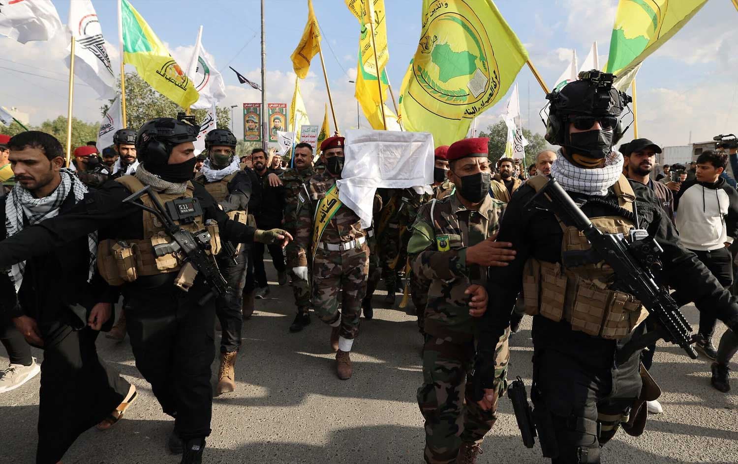 Members of the Popular Mobilization Forces (PMF) and Kata’ib Hizballah carry the coffin of a comrade in Baghdad on January 25, 2024. File photo: AFP