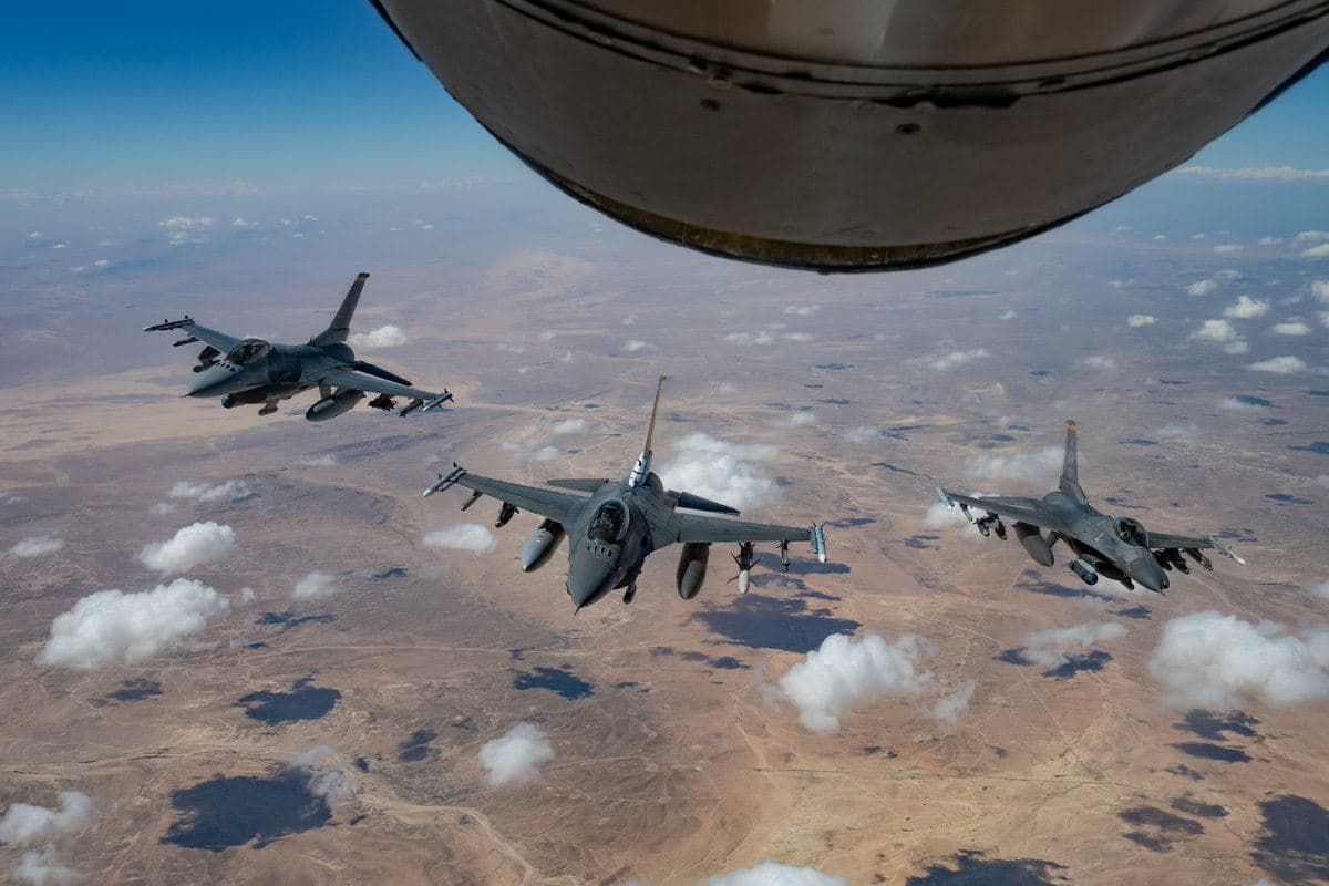 F-16 Fighting Falcons from the Air Force refuel midair from a KC-135 Stratotanker while flying over the US Central Command area of operations. Photo: CENTCOM