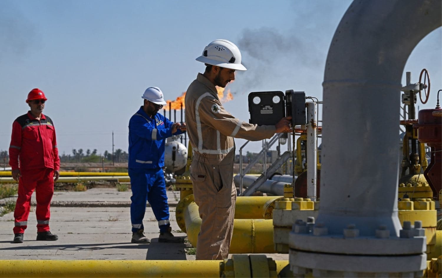 Basra oil company workers at an oil field in Basra, Iraq. File Photo: AFP