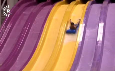 Iranians find relief from heat, sanctions at water park in Tehran