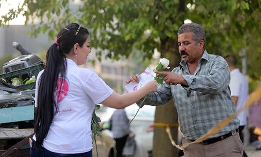 Volunteers hand out flowers, good vibes in Sulaimani