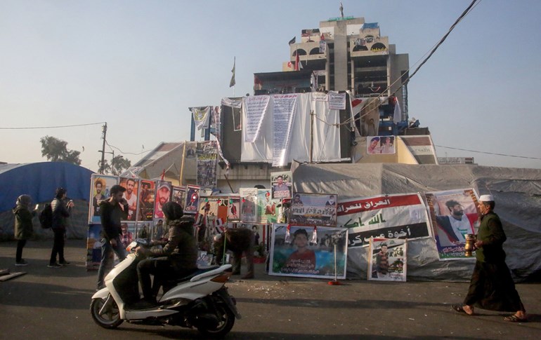 Iraqis walk at Baghdad's Tahrir Square on January 3, 2020. Photo: AFP