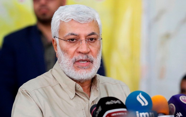   Abu Mahdi al-Mohandis, deputy head of the PMF, holds a press conference during a visit to Basra on January 23, 2018. File photo: Haidar Mohammed Ali / AFP
