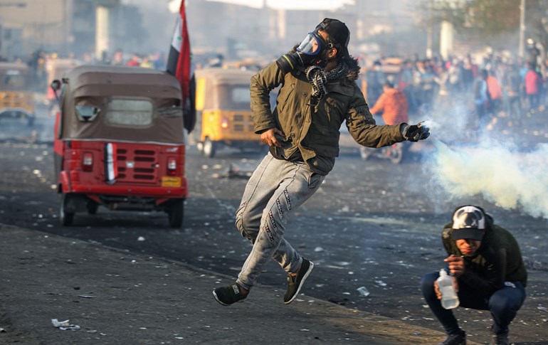 خۆپیشاندەرانی لە گۆڕەپانی تەیەران لە بەغدا، وێنە؛ AFP