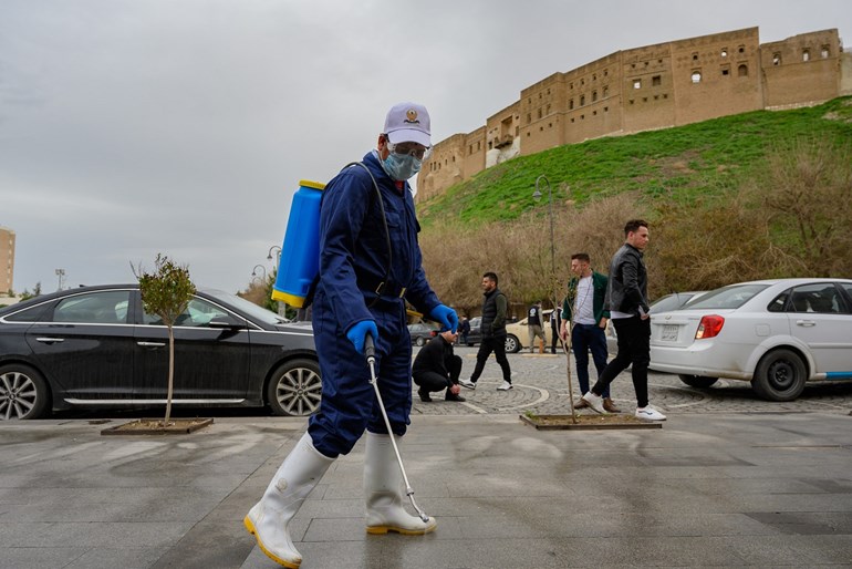 A worker disinfects the Erbil citadel. Photo: Bilind T. Abdullah