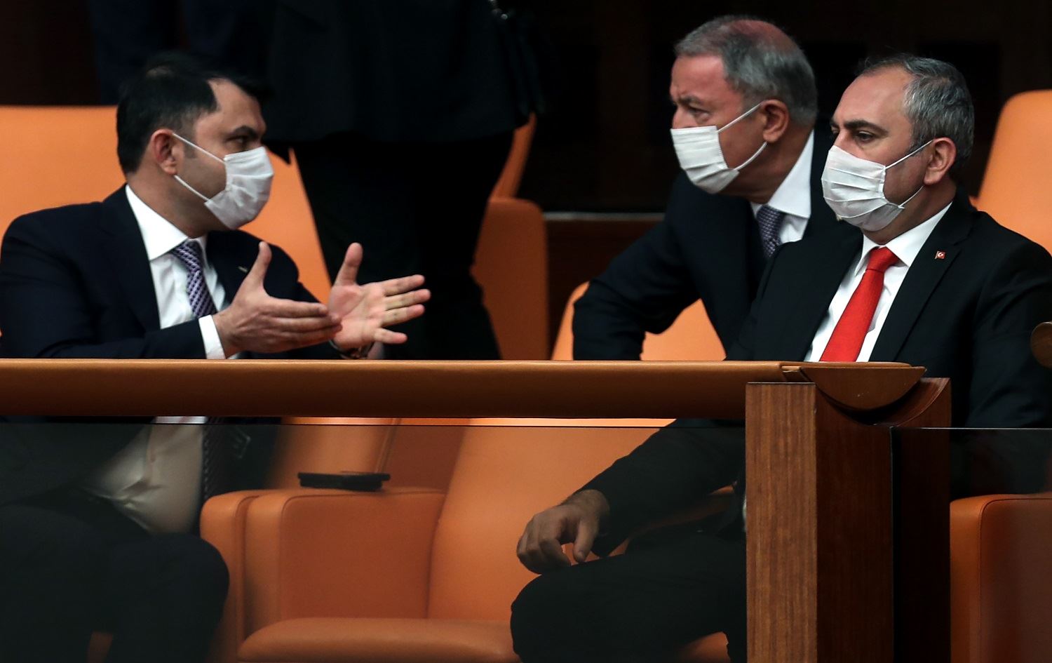 Turkish Minister of Youth and Sports, Mehmet Muharrem Kasapoglu (L), Turkish National Defence Minister Hulusi Akar(C) and Turkish Justice Minister Abdulhamit Gul(R), wear a protective facemask as a preventive measure against the spread of the COVID-19 (novel coronavirus), during a special session at the Grand National Assembly of Turkey in Ankara on April 23, 2020. Photo: Adem Altan/ AFP