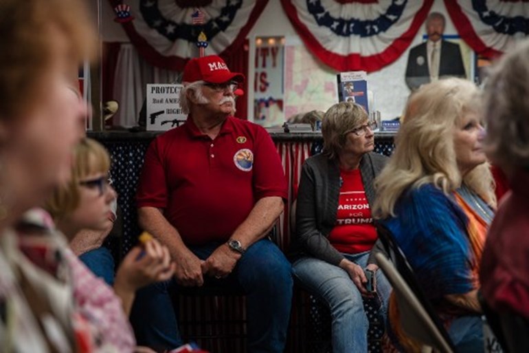 Supporters of US President Donald Trump watch the television to see the numbers coming in at the Cochise County Republican Headquarters in Sierra Vista, Arizona on November 3, 2020. ARIANA DREHSLER / AFP
