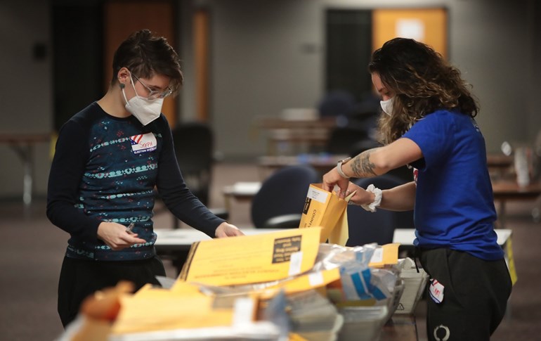 Election officials count absentee ballots on November 4, 2020 in Milwaukee, Wisconsin. Photo: Scott Olson/Getty Images/AFP