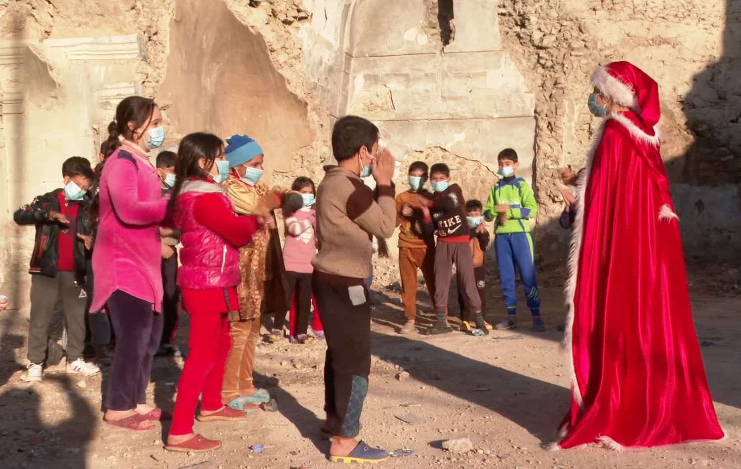 Mother Christmas gifts joy to Mosul's children