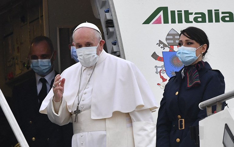 Pope Francis boards a plane as he departs Rome for Baghdad on March 5, 2021. Photo: Andreas Solaro/AFP