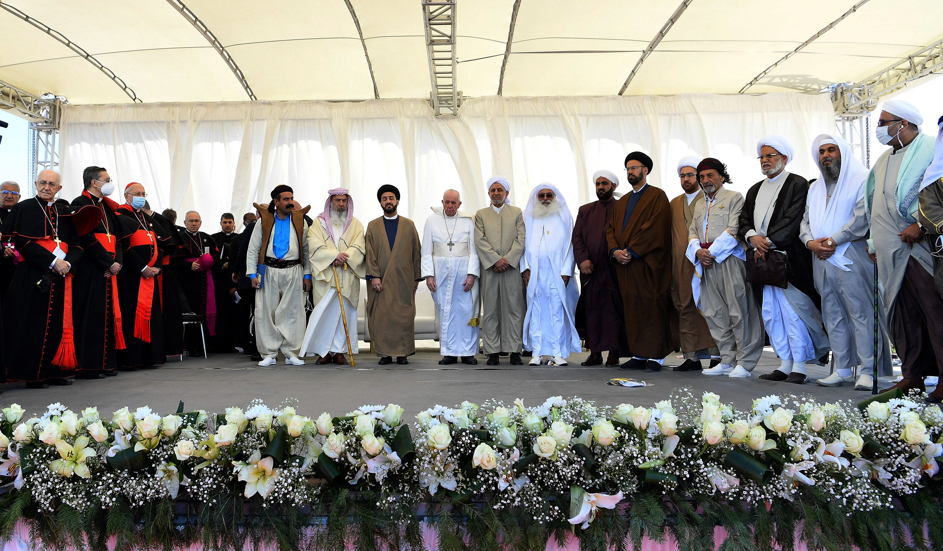 Iraq's Prime Minister Mustafa al-Kadhimi (R) welcomes Pope Francis to Baghdad on March 5, 2021. Photo: Ayman Henna/AFP