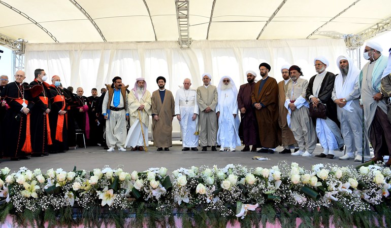 Iraq's Prime Minister Mustafa al-Kadhimi (R) welcomes Pope Francis to Baghdad on March 5, 2021. Photo: Ayman Henna/AFP