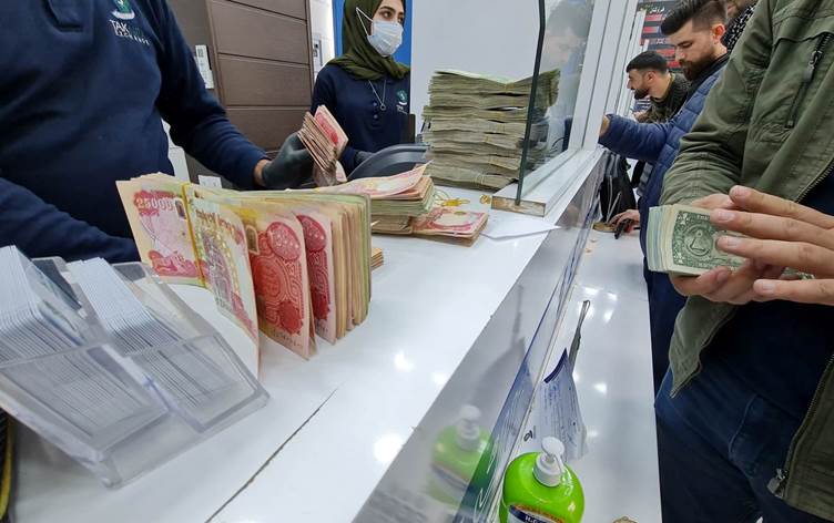 Dinars and dollars at a currency exchange office in Erbil. Picture: High Tahir - Event