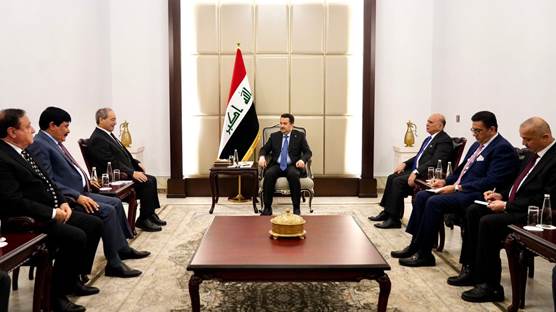 رئيس الوزراء العراقي محمد شياع السوداني خلال استقباله وزير الخارجية السوري فيصل المقداد