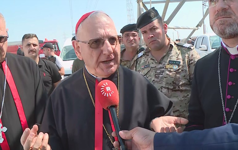 Chaldean Patriatch Cardinal Louis Sako speaking to Rudaw outside the Hamdaniya graveyard on September 27, 2023. Photo: Rudaw
