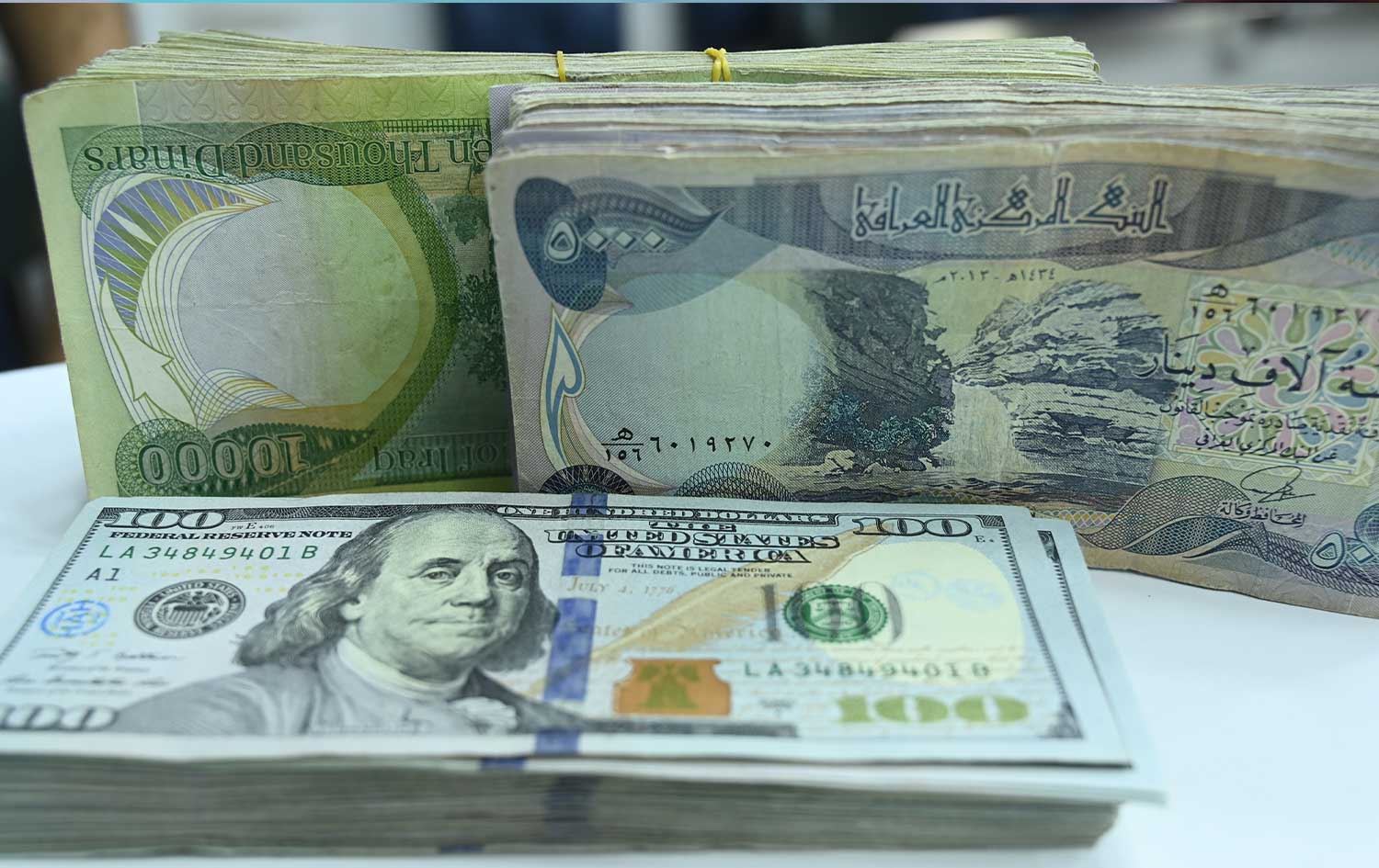 دیناری عێراقی و دۆلاری ئەمریکی، وێنە : بڵند تاهیر - رووداو