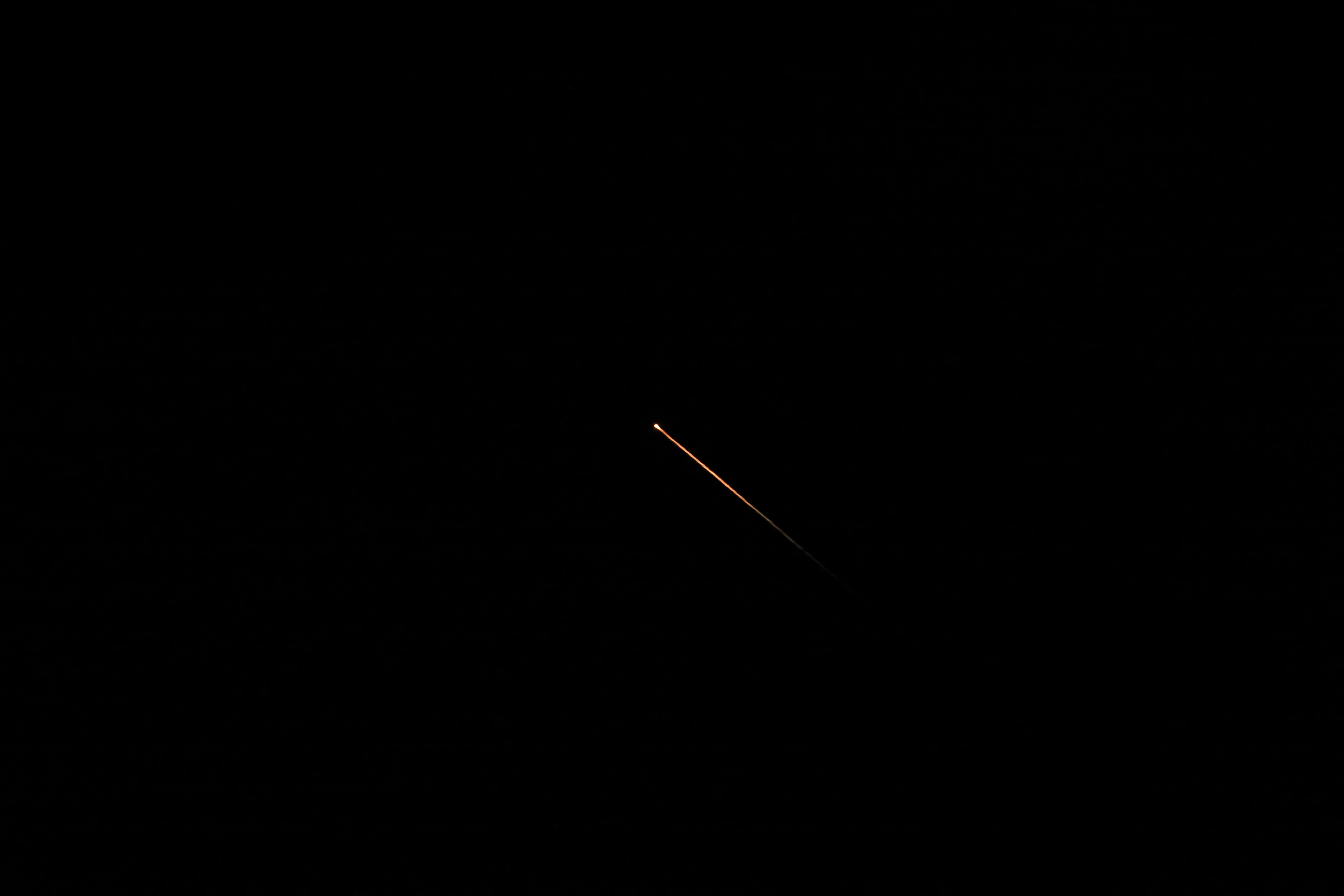 Intercepted missiles that were fired from Iran towards Israel, as seen over northern Israel. Photo: Jalaa Marey / AFP