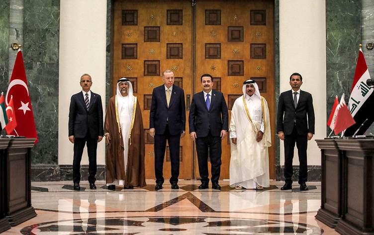 (L to R) Turkey's Transport Minister Abdulkadir Uraloglu, UAE's Energy Minister Suhail Mohamed al-Mazrouei, Turkey's President Recep Tayyip Erdogan, Iraq's Prime Minister Mohammed Shia al-Sudani, Qatar's Minister of Transport Jassim bin Saif bin Ahmed al-Sulaiti, and Iraq's Transport Minister Razzaq Muhaibas al-Saadawi pose for a picture during their meeting for the signing of the 