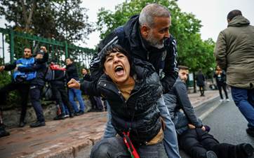 Turkish police detain a protester as she and others attempt to march to Taksim Square, at Mecidiyekoy district near Taksim, during a Labour Day rally in Istanbul on May 1, 2024. Photo: Kemal ASLAN / AFP