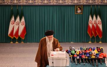 Iran's Supreme Leader Ayatollah Ali Khamenei casts his ballot during the parliamentary runoff elections in Tehran on May 10, 2024. Photo: ATTA KENARE / AFP