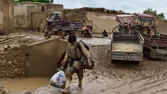 Li Efxanistanê ji ber lehiyê 300 kesî canê xwe ji dest da / Wêne: AFP