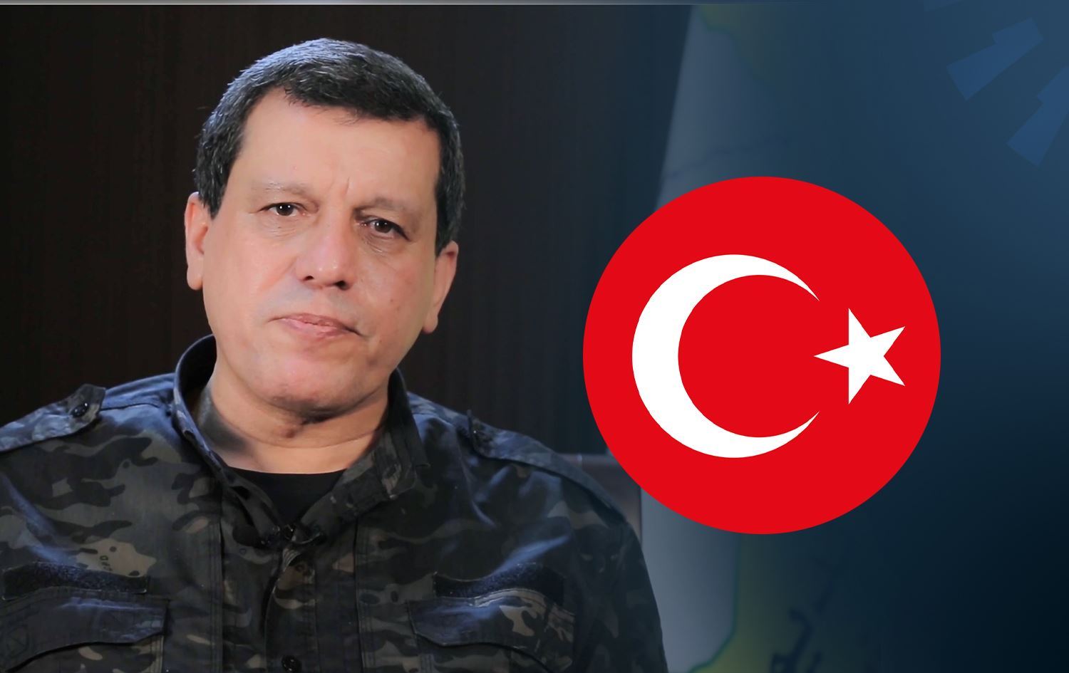 Mazlûm Ebdî bi rêya vîdeoyekê "Şoreşa Rojavayê Kurdistanê" pîroz kir /Wêne: Rûdaw Grafîk