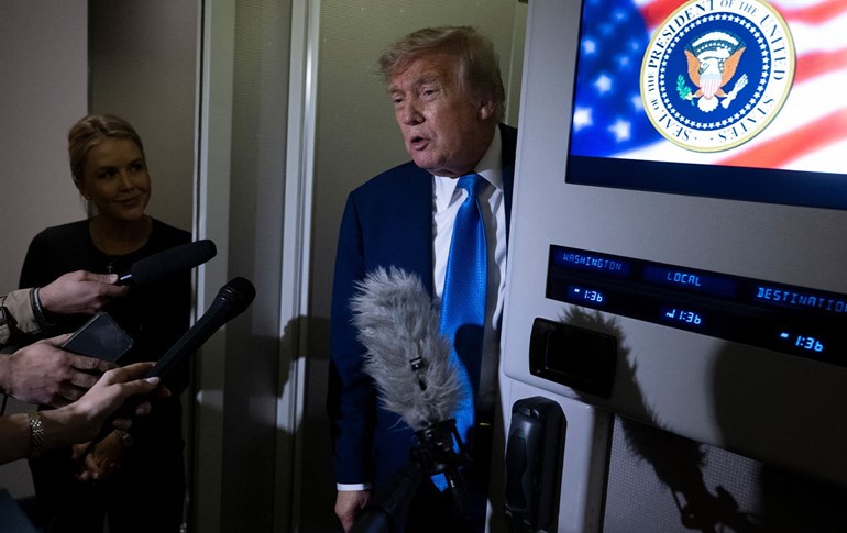 US President Donald Trump speaks to reporters about the G7 Summit aboard Air Force One while travelling back to Washington from Canada on June 16, 2025. Photo: AFP