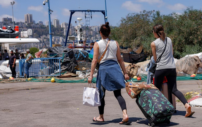 گەشتیارانی ئیسرائیل، باکووری بەندەری حەیفا چۆڵ دەکەن. وێنە: AFP