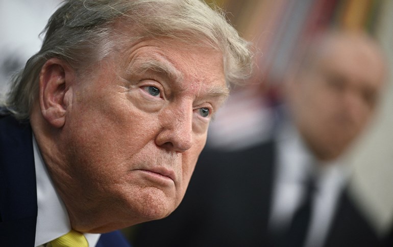 US President Donald Trump speaks to the press in the Oval Office of the White House as members of Italian soccer club Juventus pay a visit in Washington, DC, on June 18, 2025. Photo: AFP