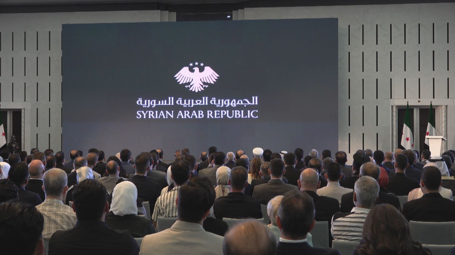 Syria unveils new national emblem