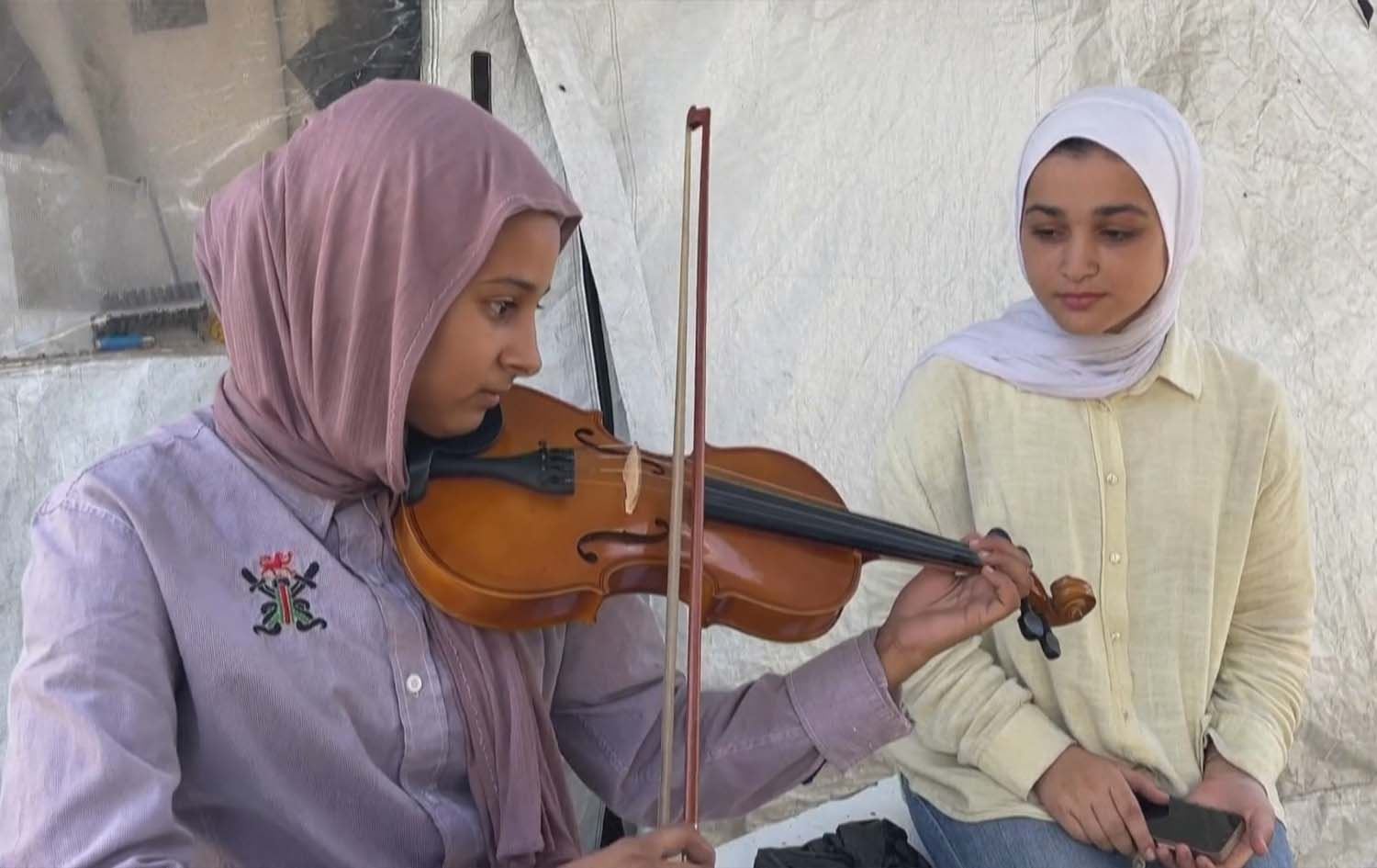 لە غەززە بە میوزیک کاریگەری جەنگ لەسەر منداڵان کەم دەکرێتەوە