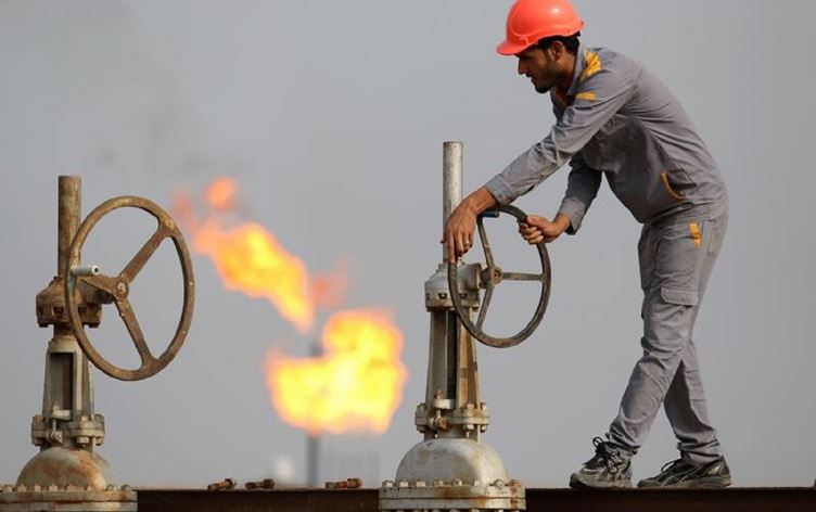 An Iraqi labourer works at an oil refinery in the southern town of Nasiriyah. AFP file photo
