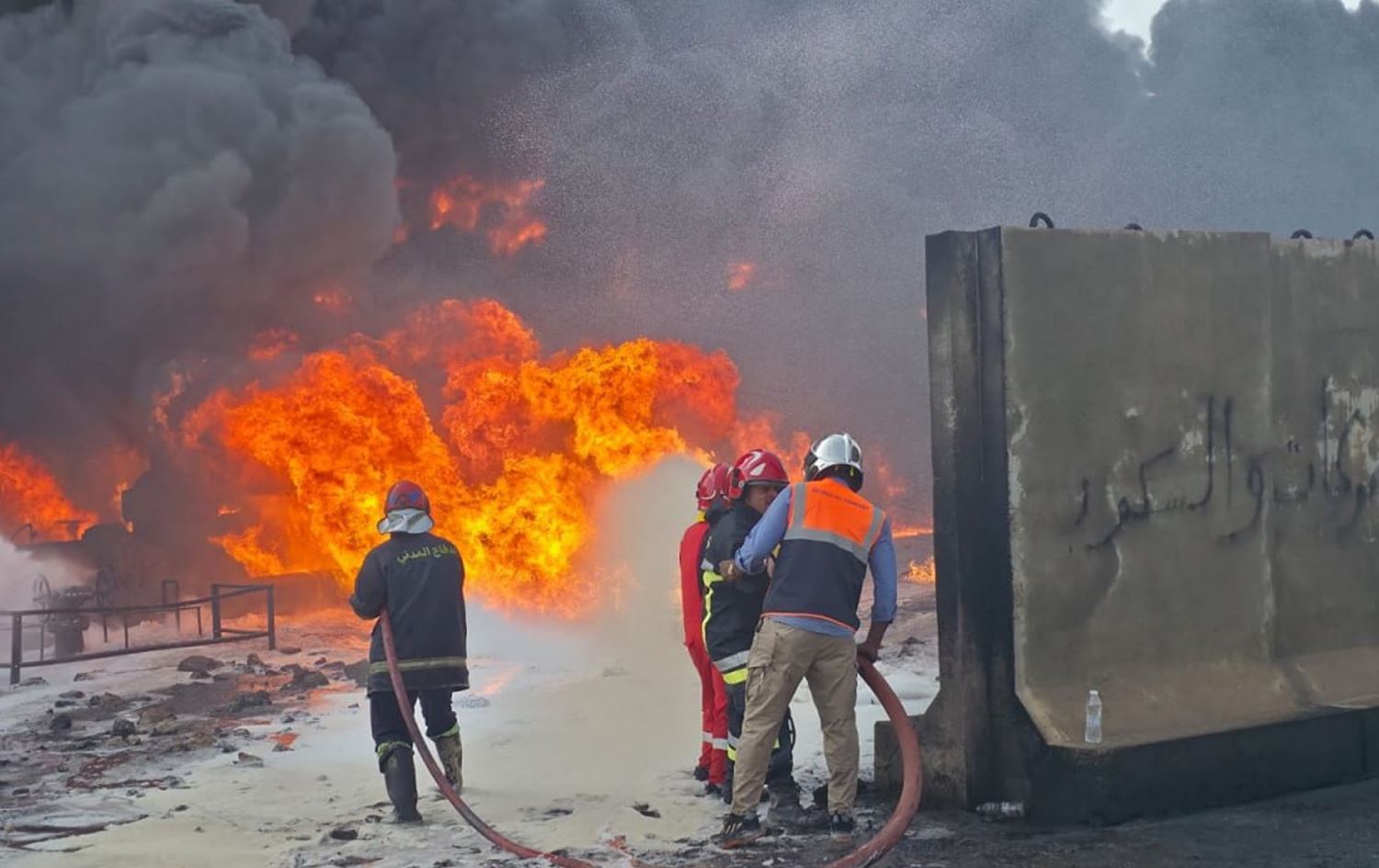 Firefighters battling flames following an explosion at an oil storage depot in Basra on Sunday, October 26, 2025. Photo: Iraqi state media