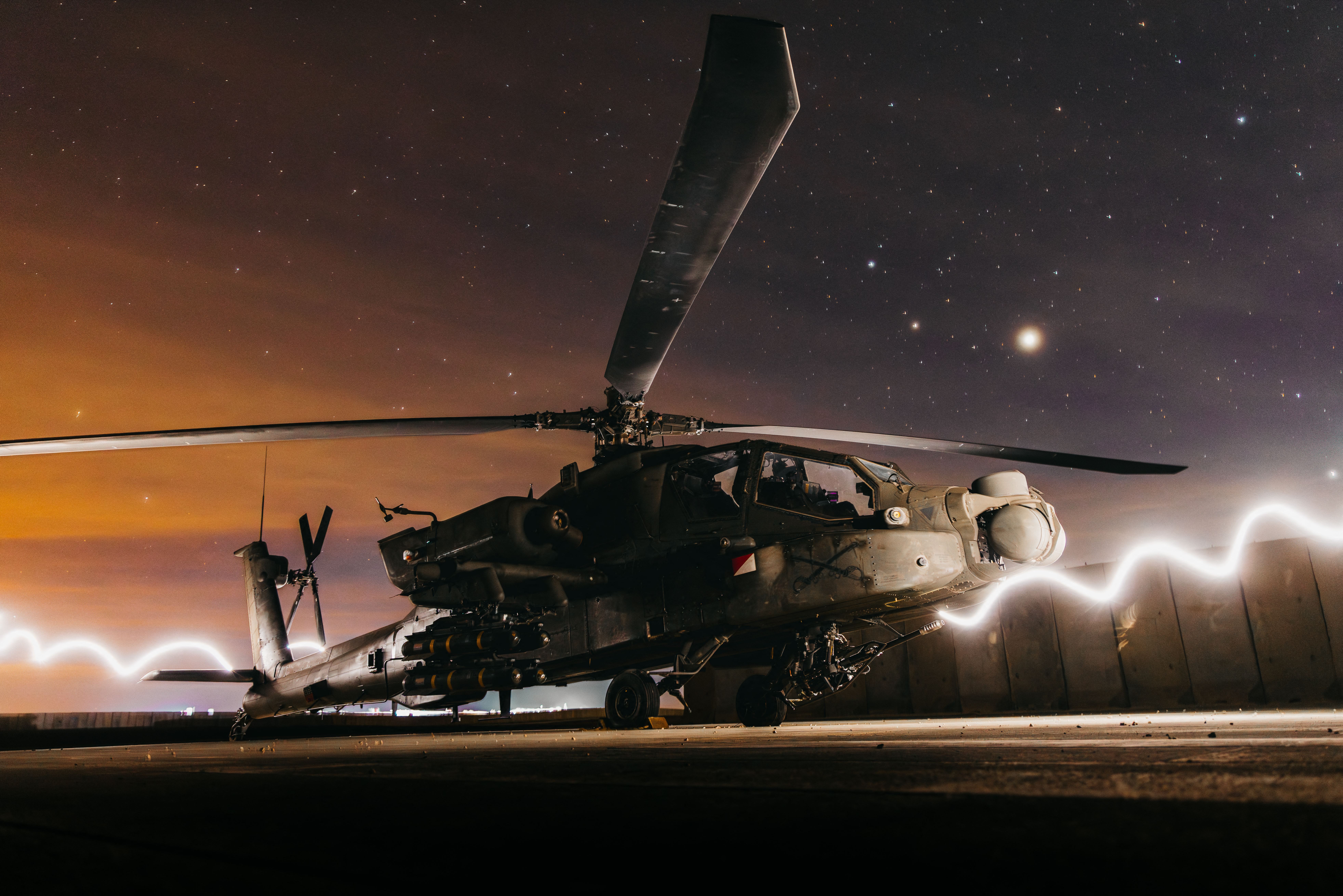 In this US Army photo taken from an undisclosed location on December 19, 2025, an US Army AH-64 Apache Attack Helicopter prepares to support Operation Hawkeye Strike in the US Central Command area of responsibility. Photo: US Air Force 