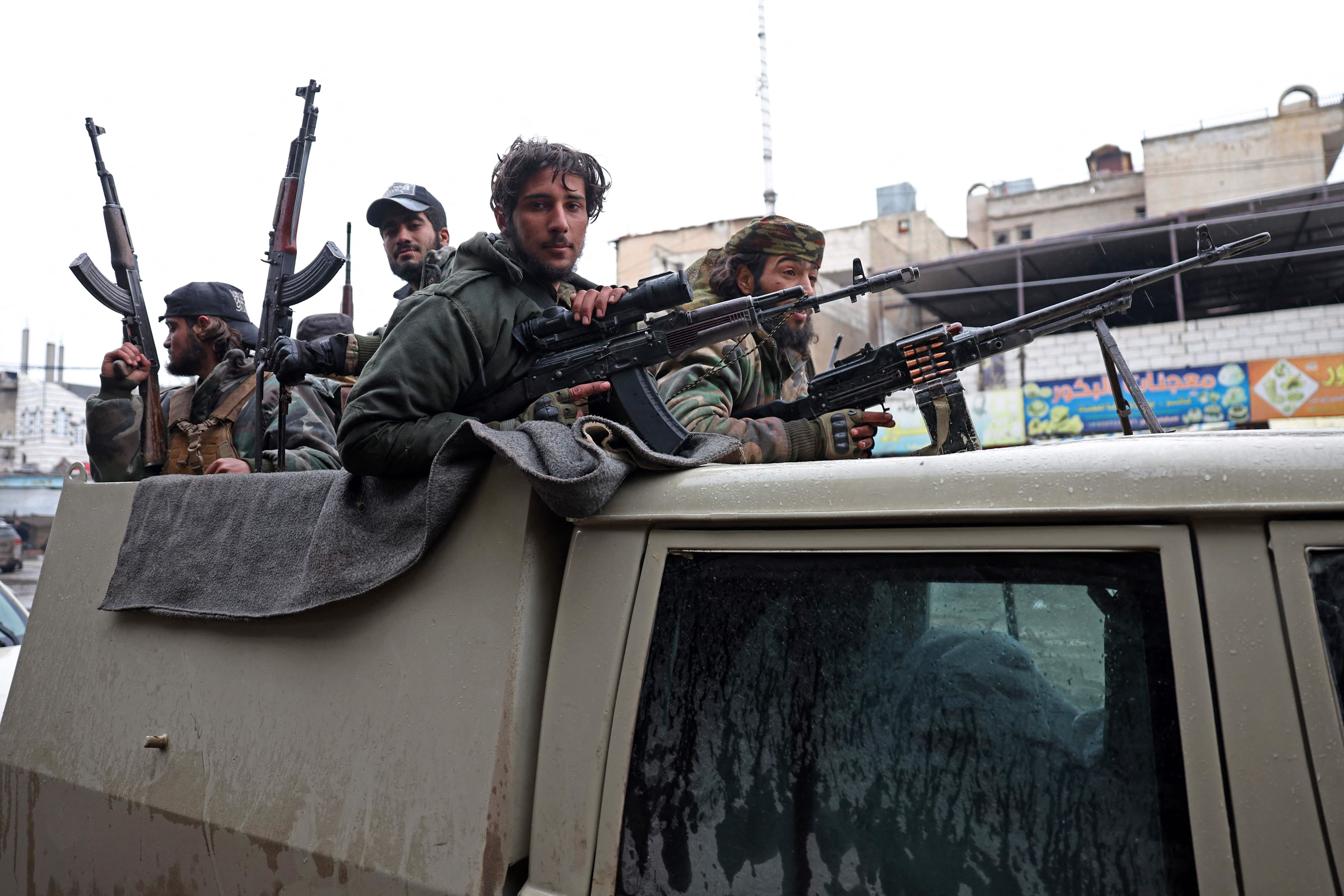 ژمارەیەک چەکداری سەر بە سوپای عەرەبیی سووریا. وێنە: AFP